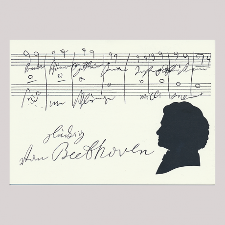 
        Front of silhouette, with man looking left, in the background musical stave, with the signature of the subject of the silhouette.